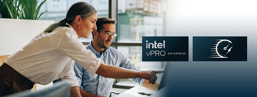 İş yerinde bilgisayar ekranına bakarken çalışan kadın ve erkek, Intel vPro teknolojisi ve güvenliği simgeleyen görsellerle profesyonel ofis ortamı.